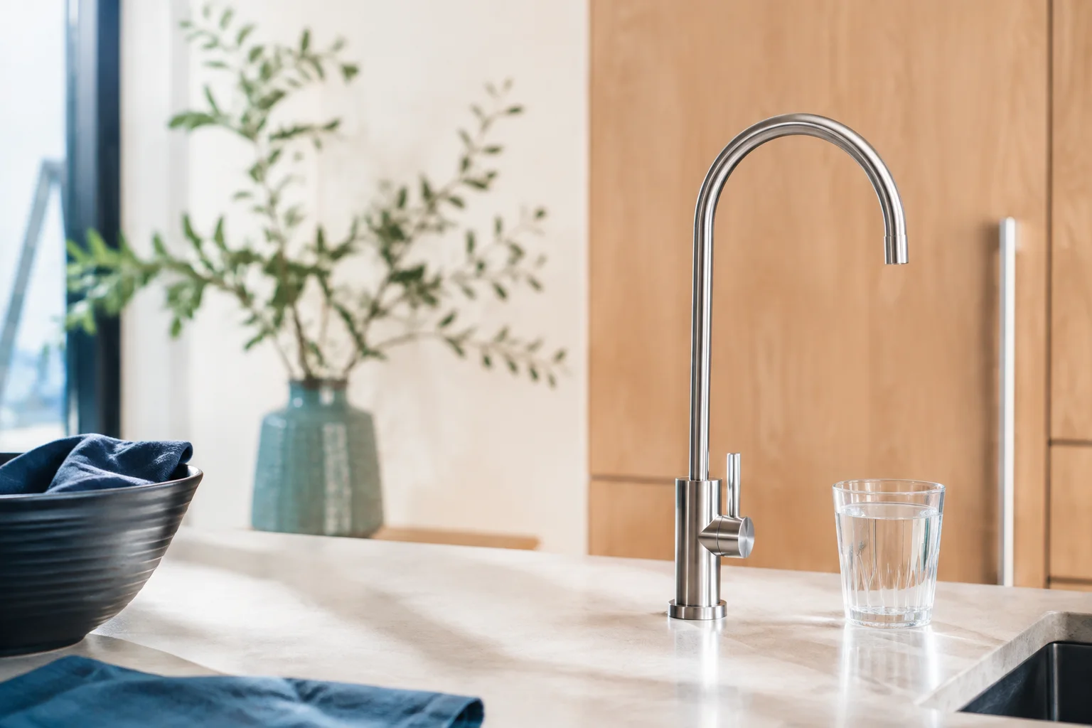 Illustrative dedicated drinking-water faucet and glass